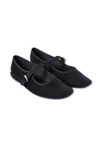 Black suede shoes with a flat sole, rounded toe, and a decorative strap across the instep featuring a gold-tone hardware accent.