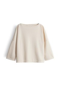 Beige Langarm-Oberteil mit lockerer Passform und U-Boot-Ausschnitt, flach auf einem weißen Hintergrund ausgelegt.