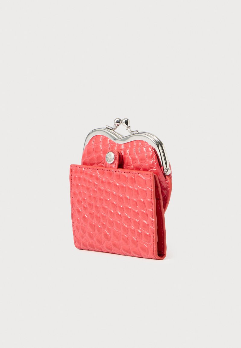 Pink crocodile-patterned wallet made of glossy material, featuring a silver clasp and rounded top, compact rectangular shape with a side pocket.