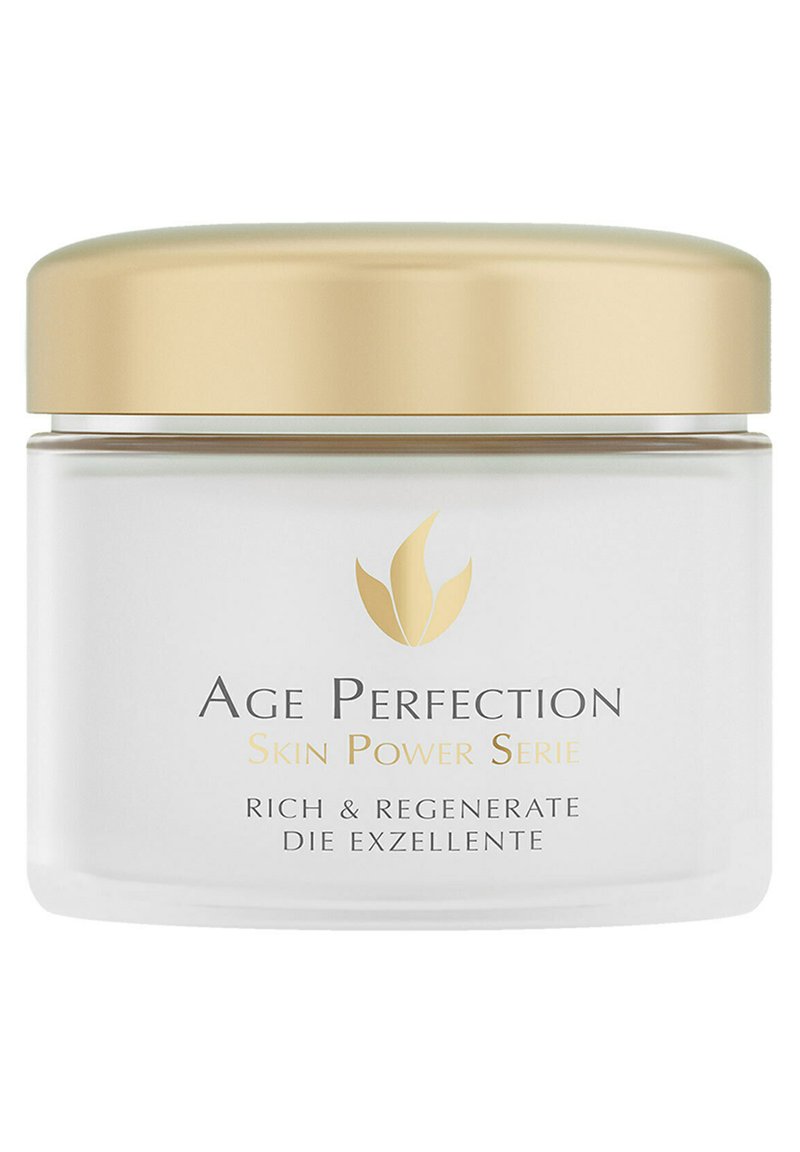 Weißes Glasgefäß mit einem goldenen Deckel, das ein Etikett "Age Perfection Skin Power Serie" in dunkel- und hellgrauem Text trägt. Einfaches Design, elegante Erscheinung.