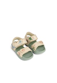 Kerged sandaalid pehme koorevärviga ülaosaga, roheliste talladega ja reguleeritavate rihmadega, millel on veealused illustratsioonid nagu kaheksajalad ja meritähnad.