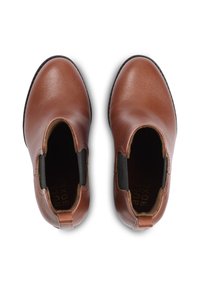Brown leather ankle boots with elastic side panels, rounded toe, and textured surface. Black rubber soles. Branding visible inside.