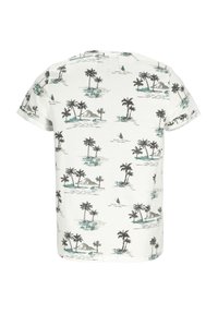 Kortärmad vit t-shirt med ett svart och tealfärgat tryck av palmträd och ö, med en avslappnad passform och mjuk textur.