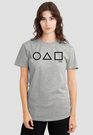 Gray cotton t-shirt featuring black geometric shapes (circle, triangle, square) centered on the front. Short sleeves and crew neckline.