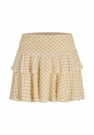 Jupe beige à volants avec des pois marron, ourlet évasé et taille froncée.