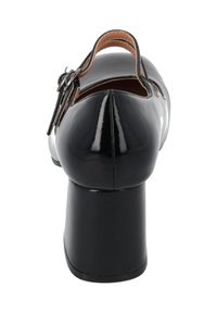 Black patent leather shoes with a rounded toe and ankle strap, featuring a chunky heel and smooth, glossy finish.