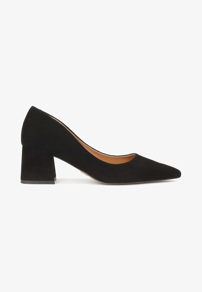 Black suede high-heel pump with a pointed toe and a chunky heel. The shoe features a smooth texture and minimalist design.