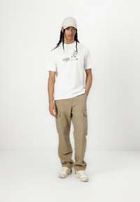 New Balance NEWBIE CHASE UNISEX - T-shirts print - white