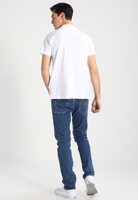 Carhartt WIP KLONDIKE MILLS - Tiesaus kirpimo džinsai - blue stone washed