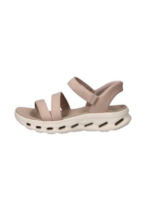 Light beige open-toe sandal with three padded fabric straps and a white cushioned sole featuring oval ventilation holes.