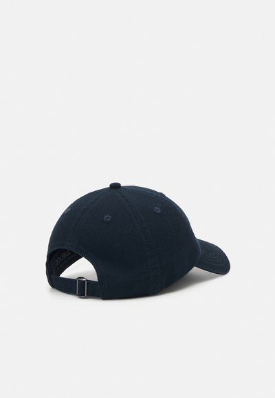 Navy blue cotton cap with a curved brim, adjustable back strap, and subtle stitched ventilation holes on the side.