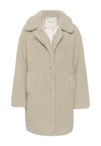 Beige teddy-villakangas, jossa on pehmeä, tekstuurinen pinta, läpällä varustettu kaulus, pitkät hihat ja sivutaskut. Etuosassa on nappikiinnitys.