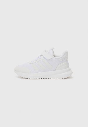 White athletic shoes with a mesh upper, a strap closure, textured accents, and a ridged sole. Features three side stripes and padded collar.