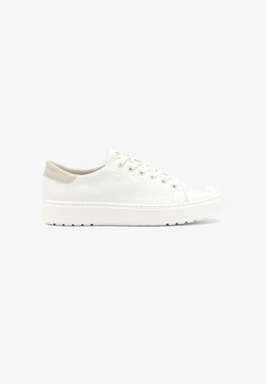 White leather sneaker with textured upper, beige accents at the heel, and a white rubber sole featuring subtle tread patterns.