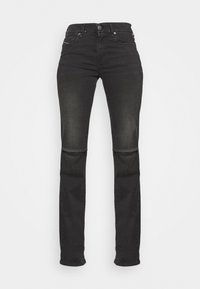 Mustat farkut slim fit -mallia, joissa on korkea vyötärö, viisi taskua ja huomaamattomat ompeluyksityiskohdat. Silkkinen pinta, jossa on vain vähäistä haalistumista.