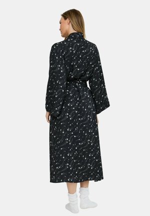 Black robe with white swirling star pattern, long sleeves, a tie belt, and a flowing silhouette that drapes to mid-calf. Soft fabric texture.