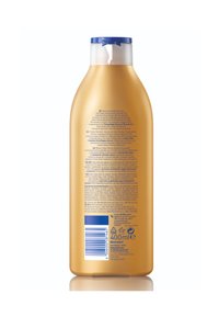 Gold-colored plastic bottle with a blue flip-top cap. Back label features white and black text with ingredient details and a barcode. 400 ml capacity.