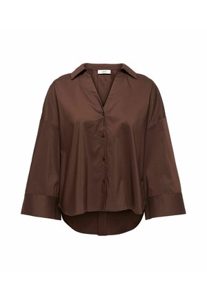 Blouse marron à manches longues avec boutons, poignets larges, col et ourlet légèrement arrondi, présentée sur un fond blanc.