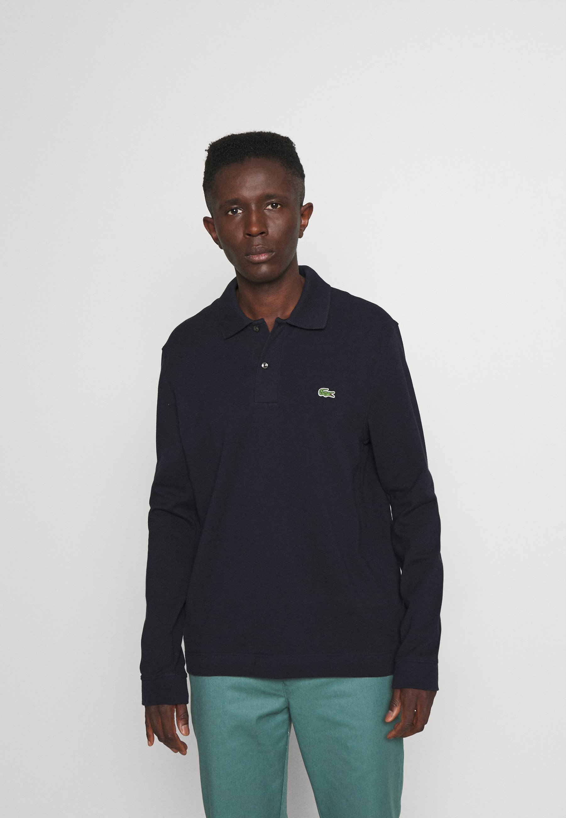 dark blue lacoste polo shirt