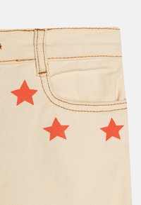 TINYCOTTONS STARS BAGGY - Vaqueros boyfriend - light cream