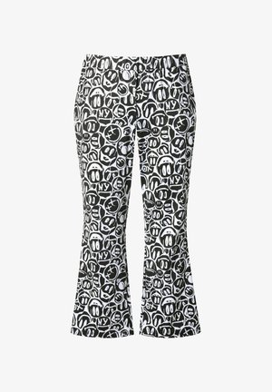 Pantalones acampanados en blanco y negro que presentan un patrón repetido de caras y símbolos de estilo caricaturesco, con una cinturilla elástica y una textura suave.