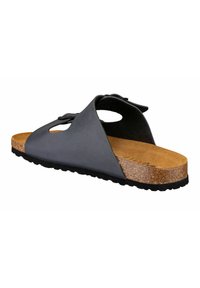 Black leather sandal with an open design, a cork insole, and textured rubber outsole. Features cutouts and a bow accent on the upper.