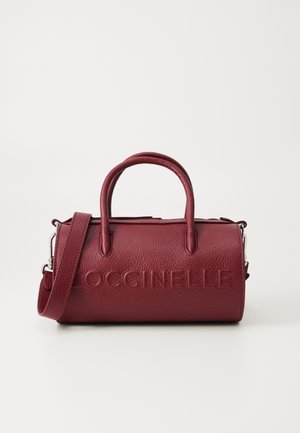Red leather handbag with textured finish, dual handles, and adjustable shoulder strap. Features embossed brand name on front.