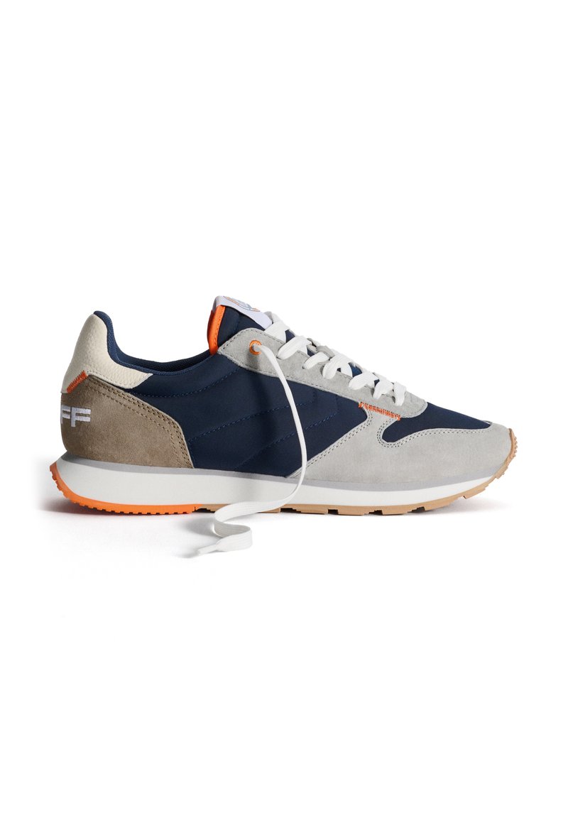 Navy and gray suede sneakers with white laces, orange accents, and a textured rubber sole. Side logo displays "EFF."