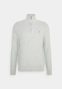 Ljust grå zip-up sweatshirt med hög krage, ribbade ärmslut och nederkant, med en liten logotyp på bröstet och ett texturerat stickmönster.