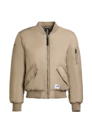 Beige Bomberjacke mit Reißverschluss, gerippten Bündchen, zwei schrägen Fronttaschen und einer kleinen Armtasche. Hergestellt aus einem glatten, gepolsterten Material.