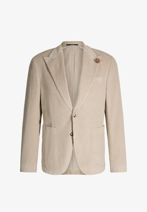 Beige corduroy blazer with notch lapels, two front patch pockets, two-button closure, and a fabric flower pin on the left lapel.