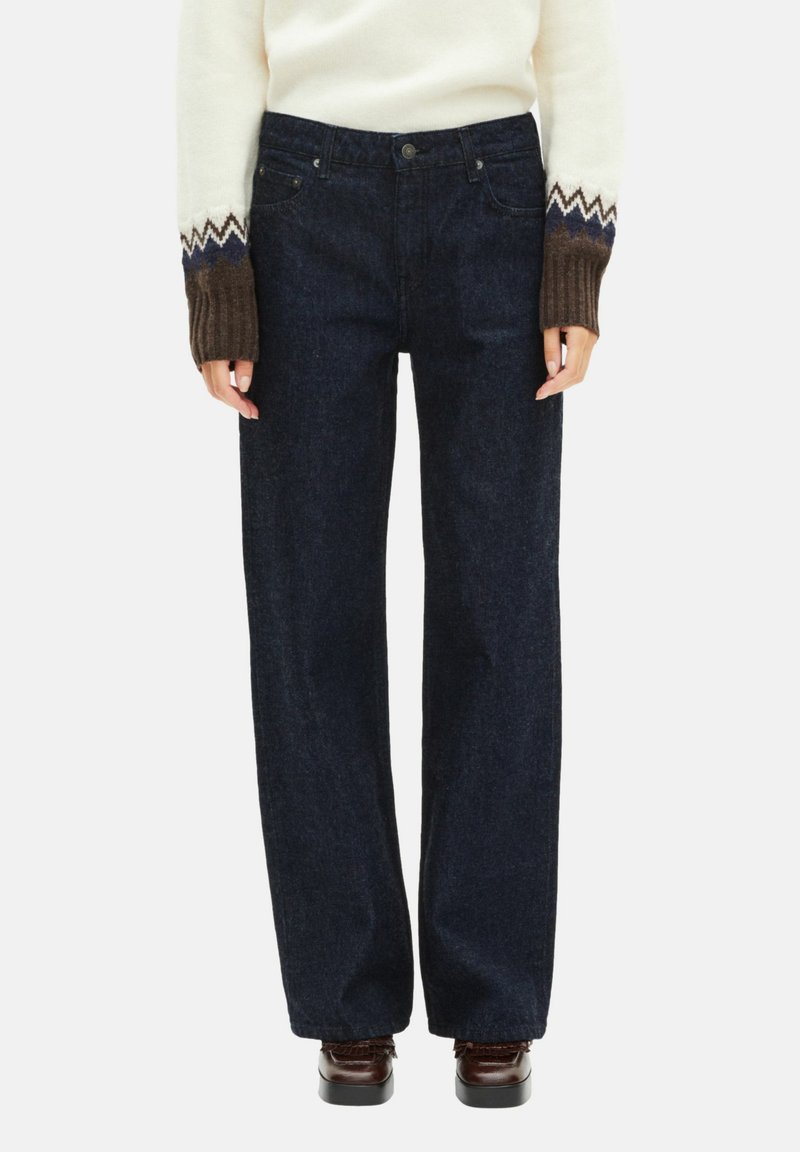 Jeans de ganga azul-escuro com um corte de perna reta. Apresenta um estilo de cinco bolsos e uma cintura clássica com passagens para cinto. Tecido texturizado.