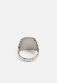Polished silver ring with a rounded design, featuring a smooth finish and wide band. Inside shows a brushed texture. No visible embellishments.