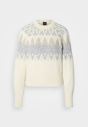Πλεκτό πουλόβερ σε κρεμ χρώμα με ριμπ μανσέτες και τελείωμα, διακοσμημένο με μπλε και μπεζ γεωμετρικά σχέδια στο στήθος και στα πάνω μανίκια.