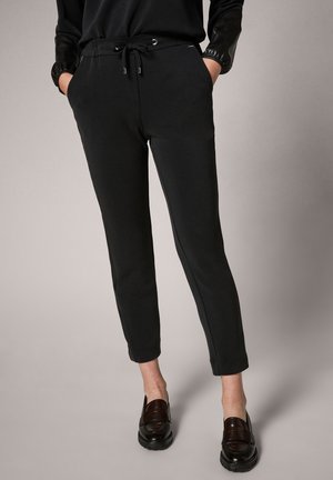 MIT KUNST - Tracksuit bottoms - black