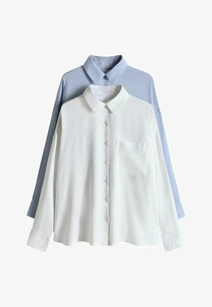 Két hosszú ujjú, gombos ing, az egyik fehér elöl mellzsebbel, a másik világoskék hátul, mindkettő hegyes gallérral.