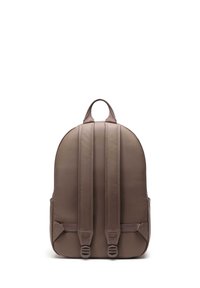 Brown backpack with a smooth texture, curved top, two padded shoulder straps, and side pockets. Features a centered top handle for easy carrying.