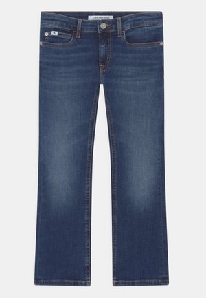 Jean Calvin Klein bleu foncé droit avec bouton et fermeture éclair à l’avant, cinq poches et légère décoloration sur les cuisses.