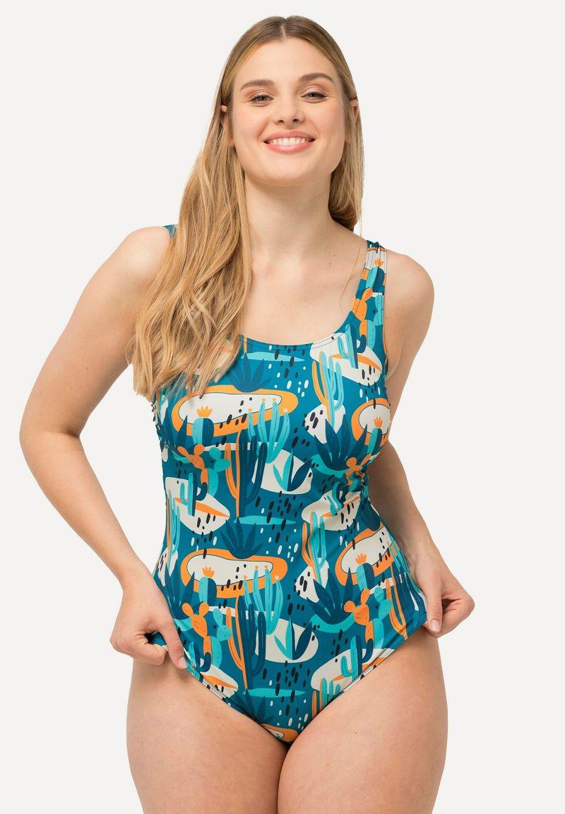 Eén stuk badpak in teal met een cactus- en abstract patroon. Heeft brede banden en een ronde hals. Glad, rekbaar materiaal.