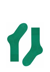 Due calze verdi brillanti esposte affiancate, una alla caviglia e l'altra alla lunghezza del polpaccio, con un logo del marchio sulla parte del piede.