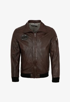 Braune Lederjacke mit durchgehendem Reißverschluss, gerippten Bündchen und Saum, mit einem runden schwarzen Patch mit dem "UNLIMITED"-Logo auf der linken Brust, Seitentaschen.