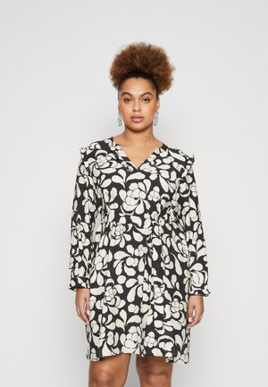 Floral print dress with black base and white flowers, long sleeves, V-neckline, and a belted waist. Lightweight fabric with textured finish.