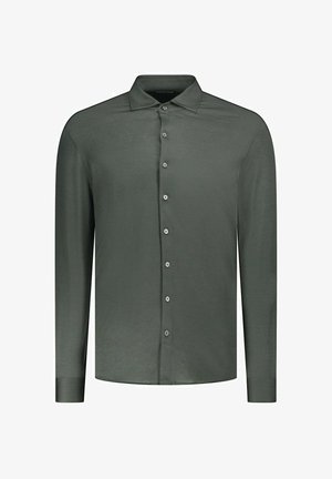 Chemise à manches longues en tissu vert foncé. Dotée d'un col, de sept boutons et de poignets ajustés. Texture lisse.