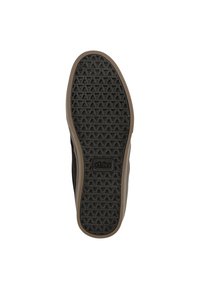 Black skate shoe sole with a textured pattern of triangles; brown rubber edging; brand logo embossed at the center.
