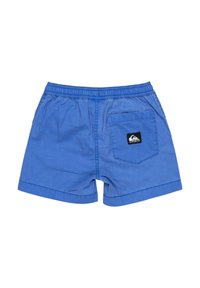 Modré bavlněné šortky s elastickým pasem, s kapsou na zádech a černou logovou nášivkou. Jednoduchý design, délka do poloviny stehen.