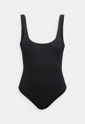 Maillot de bain une pièce noir avec larges bretelles et logo Calvin Klein discret centré sur la poitrine.
