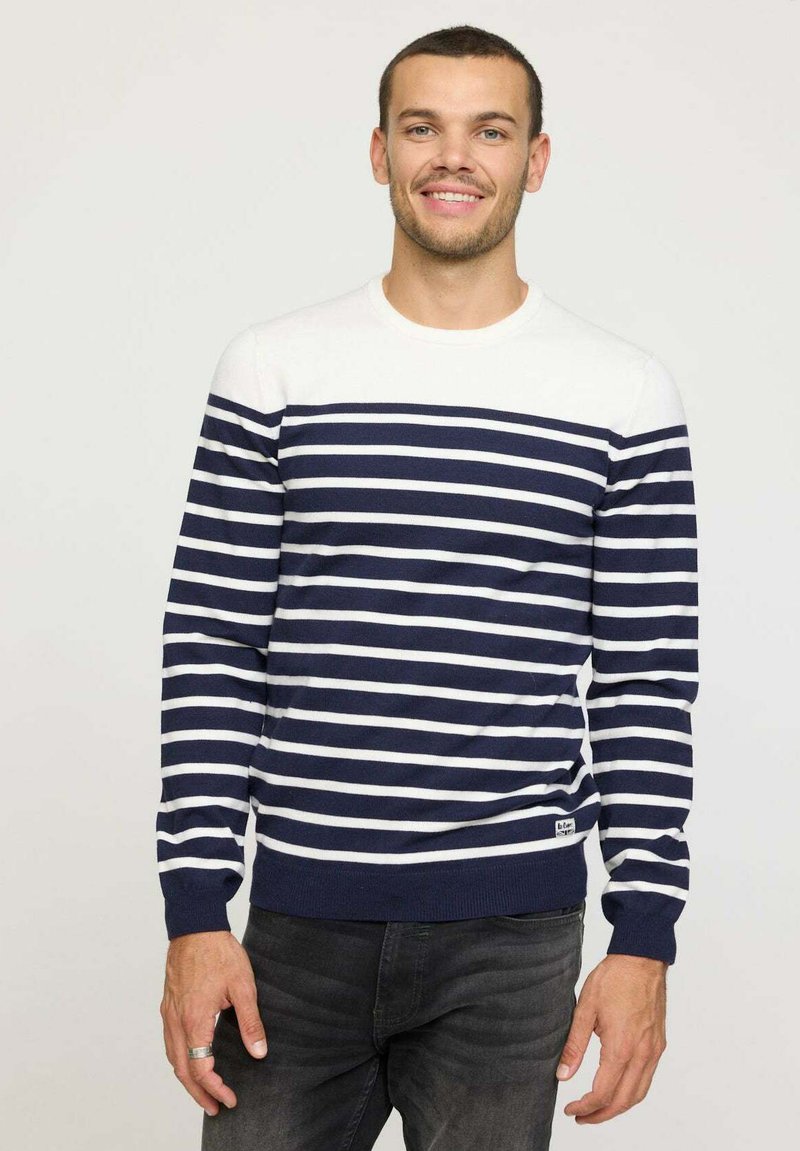 Pull rayé bleu marine et blanc avec un col rond, des manches longues, des poignets et un ourlet côtelés, fabriqué en tissu tricoté doux.