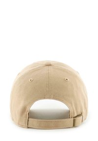 Beige cotton baseball cap with a curved brim, adjustable strap at the back, and seven ventilation eyelets. Textured fabric.