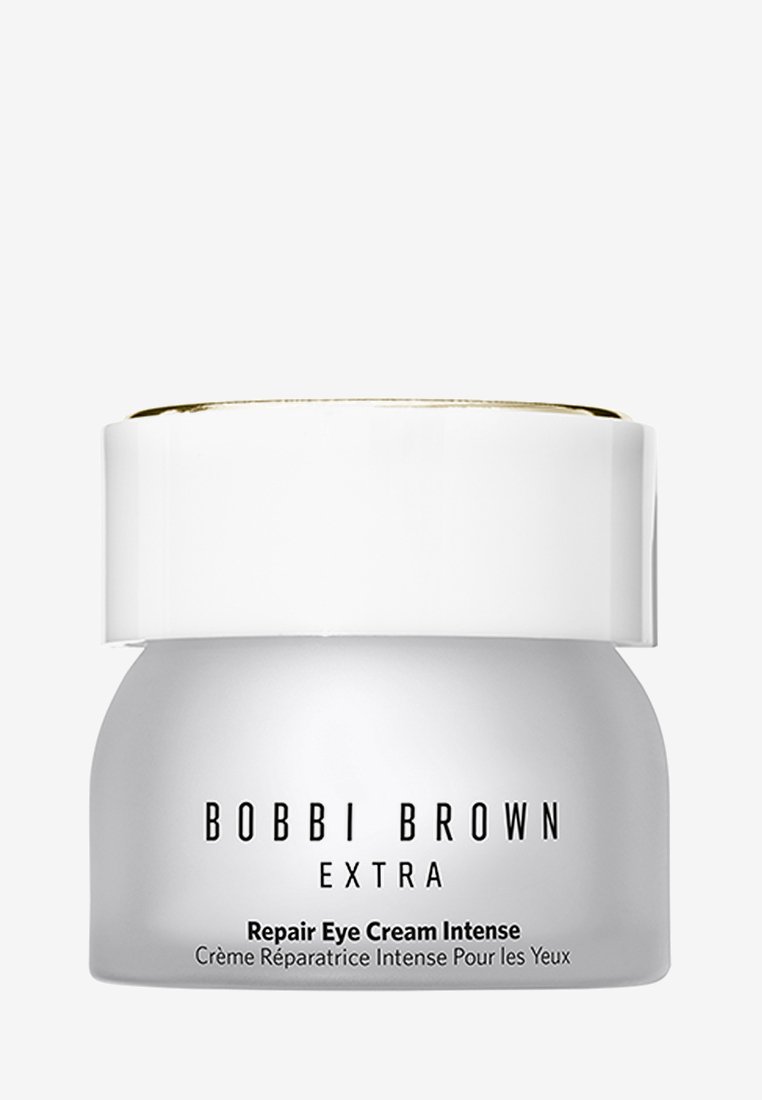 Bobbi Brown Extra Repair Eye Cream Intense w małym białym słoiku z czarnym napisem i białą pokrywką z złotym obramowaniem na białym tle.