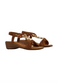 Sandales brunes avec un design avant noué, des brides élastiques à la cheville, et des accents colorés en tresses avec des perles rondes. Talon en bois bas.